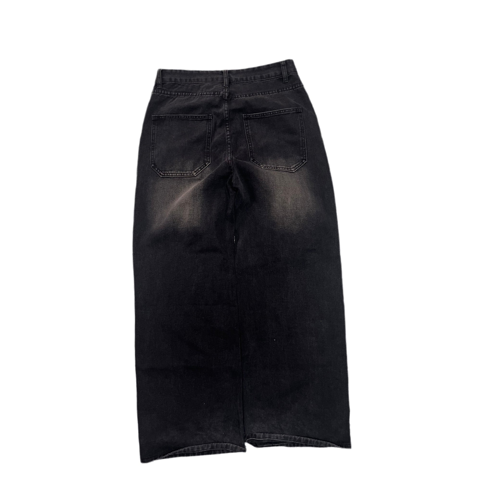 Black washed denim skirt with back pockets, shown from the back on a white background.
