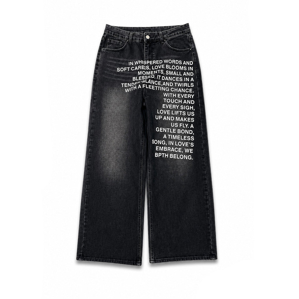 Black wide-leg denim jeans with white printed text on the front, shown flat against a white background with black side bars. The brand name 'AXIS' is visible in the bottom right corner.