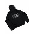 A black pullover hoodie shown from the back, featuring a white cursive 'Axis Studios' logo printed across the upper back. The hoodie is laid flat against a white background with black letterbox bars on the left and right, and a smaller 'AVS' logo watermark in the bottom right corner.