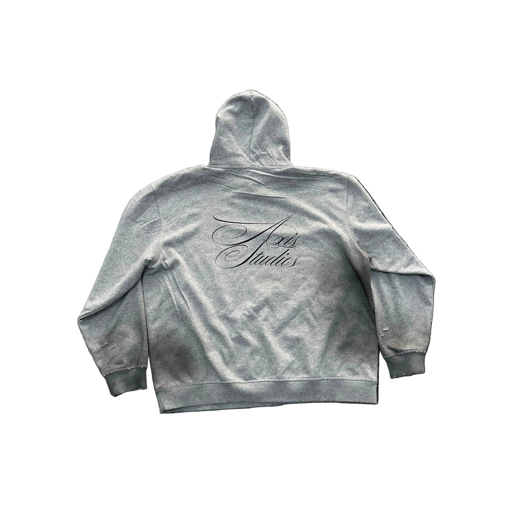 A light gray hooded sweatshirt shown from the back, featuring a black cursive script logo that reads 'Snoopy Studios' across the upper back. The hoodie has a washed, faded texture and is displayed against a plain white background.