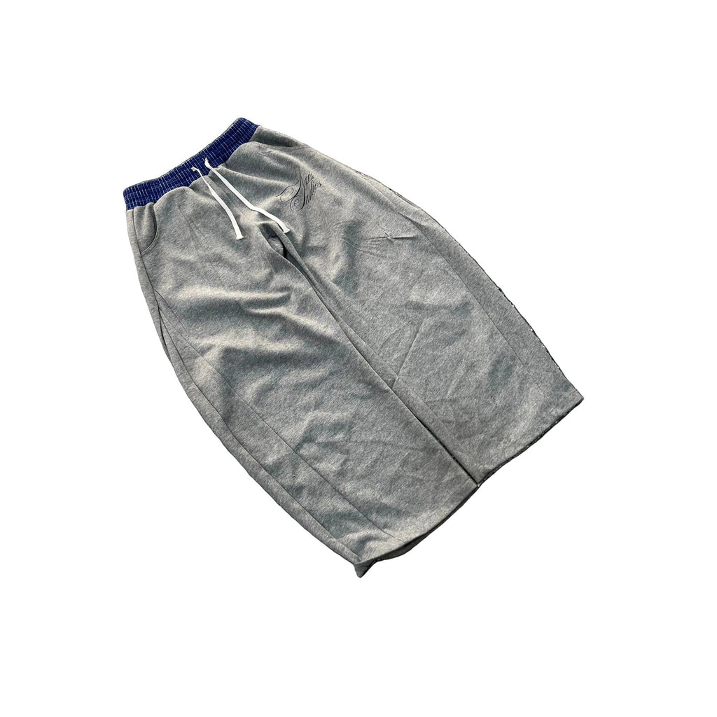 A pair of gray heather sweatpants with a dark blue elastic waistband and white drawstrings, shown flat on a white background.