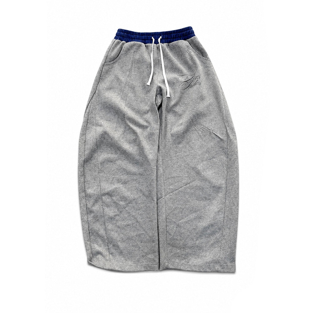 A pair of heather gray sweatpants with a dark blue ribbed elastic waistband and white drawstrings, laid flat on a white background with a black border and an AXIS logo in the bottom right corner.