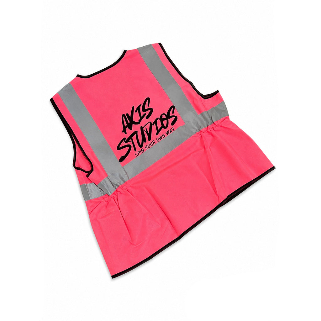 A neon pink high-visibility safety vest with reflective silver stripes and black trim, featuring the 'AXIS STUDIOS' logo printed in black on the back. The vest is displayed flat against a white background with black letterbox bars on the left and right.