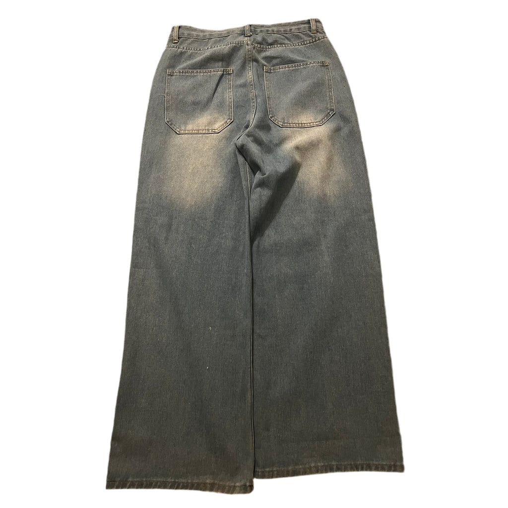 Wide-leg denim jeans in a faded gray wash, shown from the back with two back pockets, displayed flat against a white background.