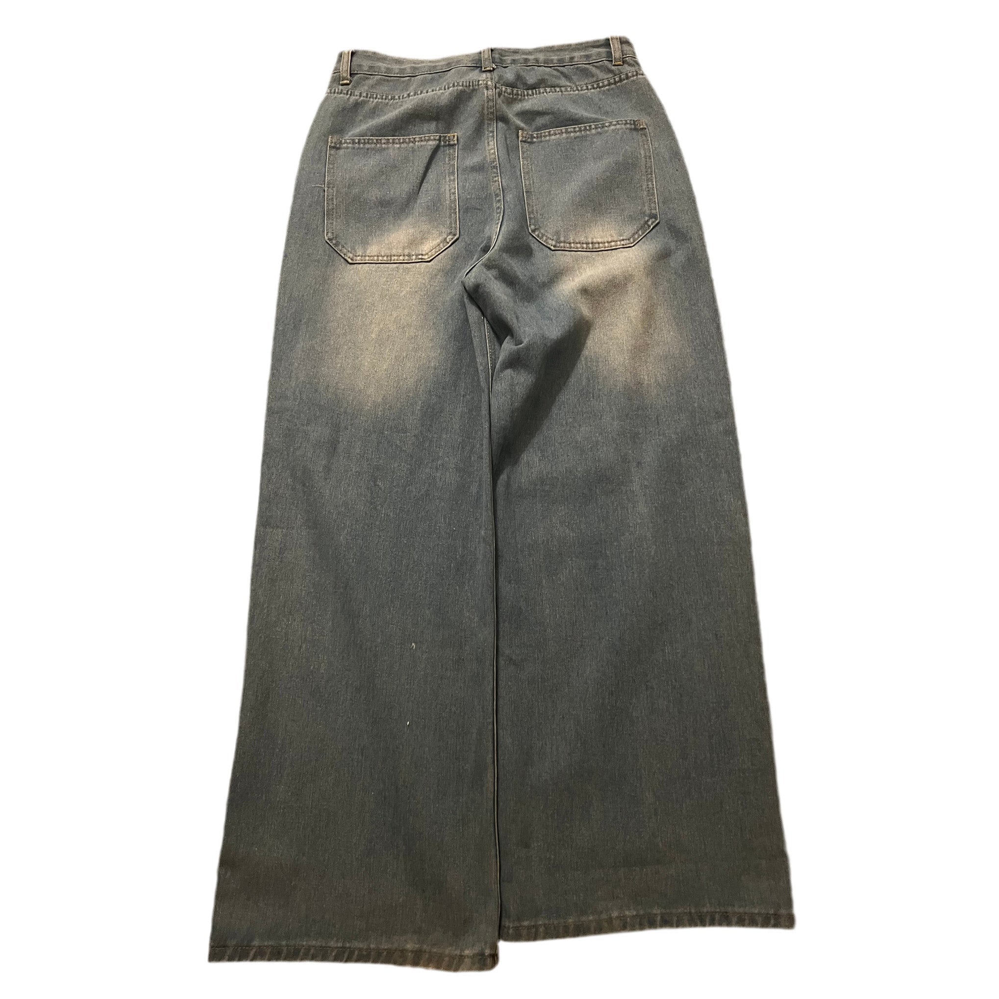 Wide-leg denim jeans in a faded gray wash, shown from the back with two back pockets, displayed flat against a white background.