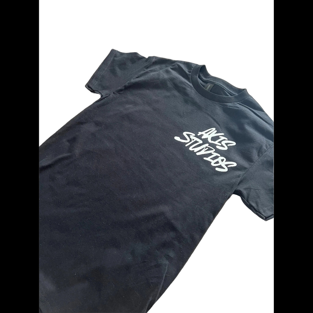 A black short-sleeve t-shirt with 'AKS STUDIOS' printed in white script across the chest, displayed on a clean white background.
