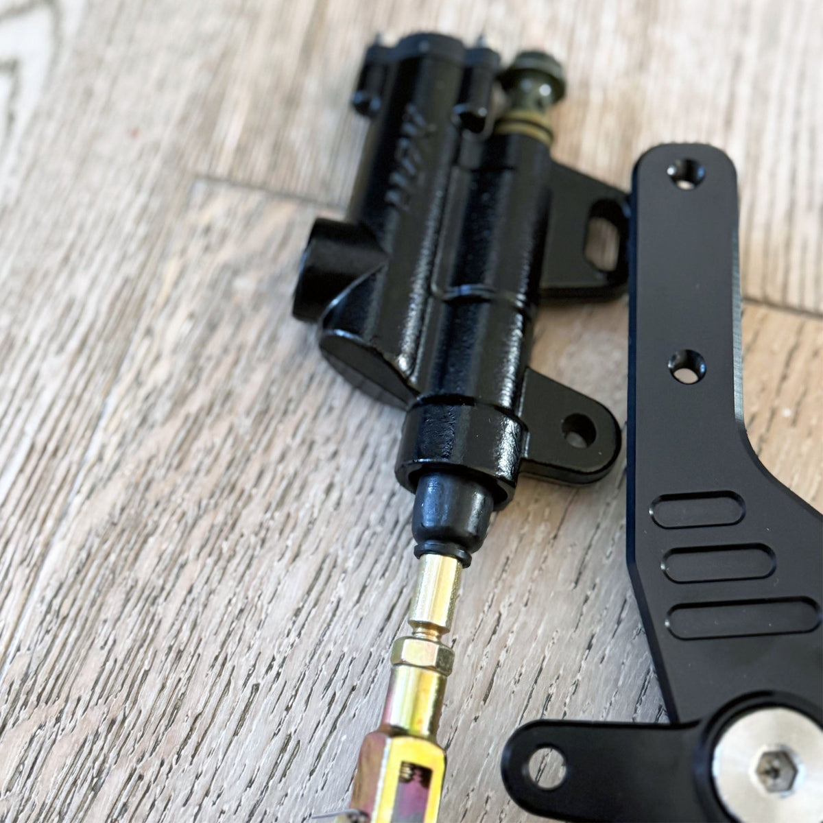Sur-Ron and E-Ride foot brake kit with Ultra Bee calipers – alternate angle