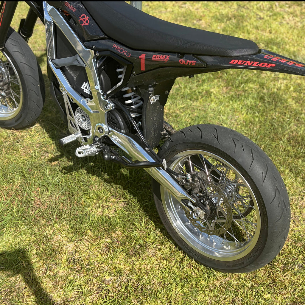 Sur-Ron Ultra Bee 17-inch supermoto wheel set in black and chrome finish – alternate angle