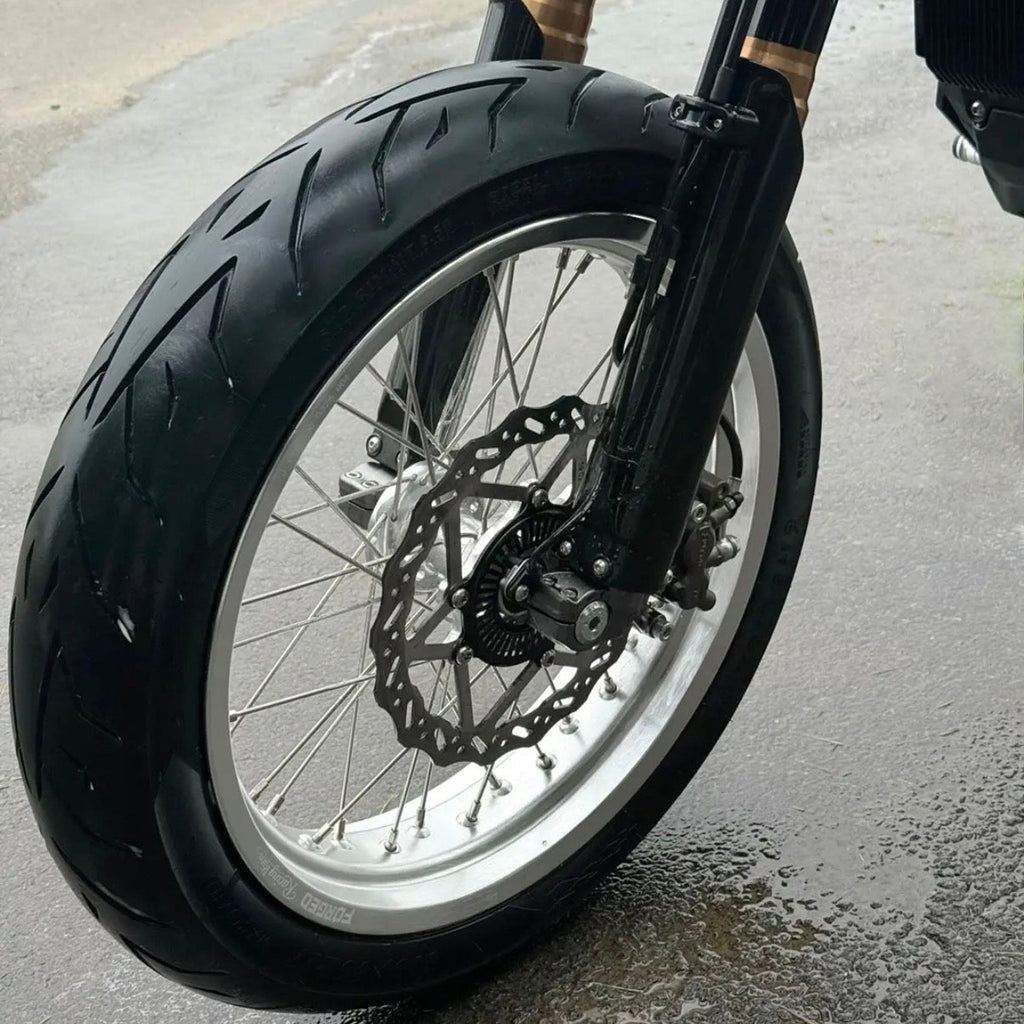 Sur-Ron Ultra Bee 17-inch supermoto wheel set in black and chrome finish – detail view