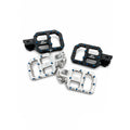 Four AXIS brand motorcycle step-through pedals shown in black and silver aluminum finishes with blue locknuts, arranged on a white background with a black AXIS logo in the bottom right corner.