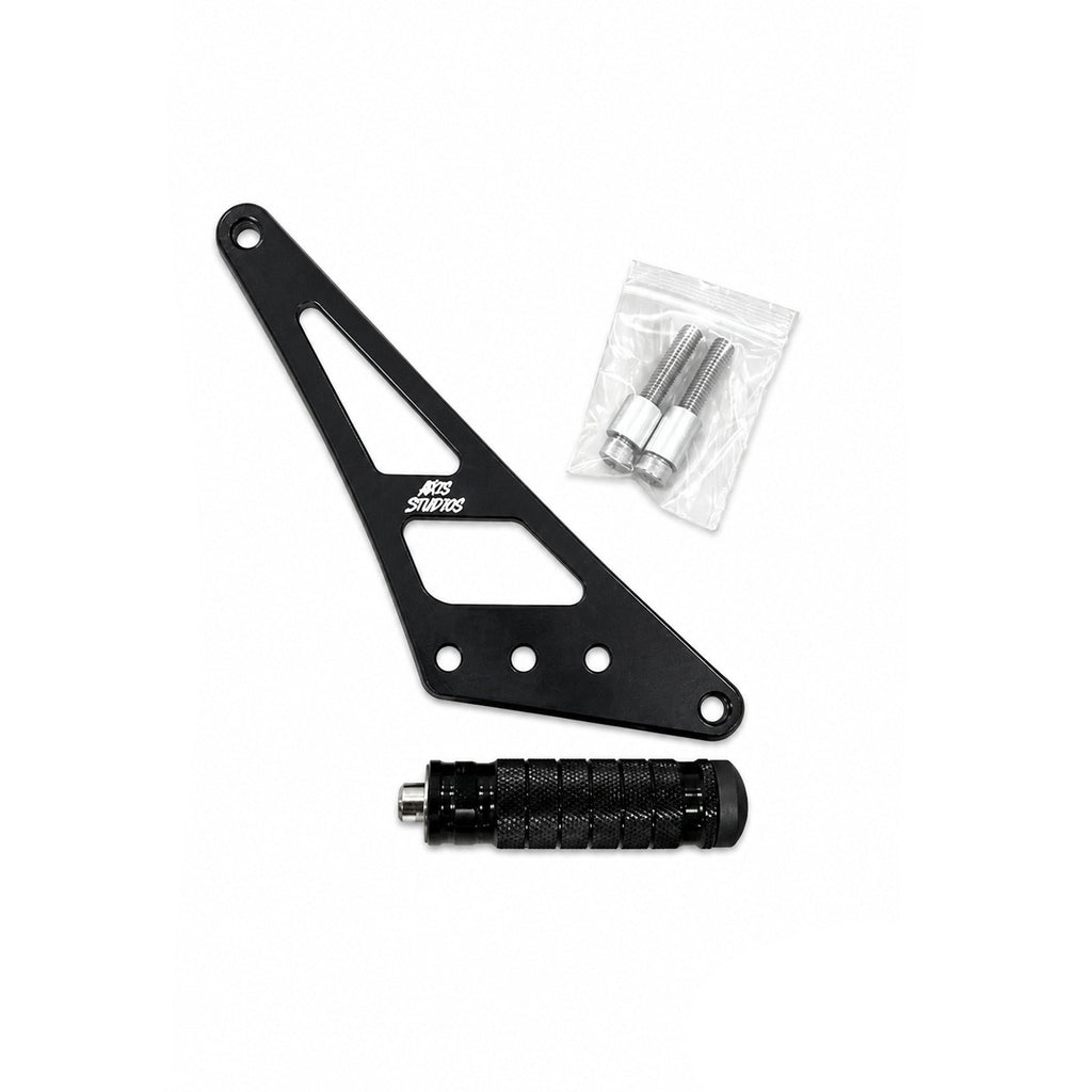 Black metal motorcycle footpeg assembly with mounting hardware, including a black textured footpeg and a small clear plastic bag of silver bolts and washers, shown on a white background with AXIS branding.